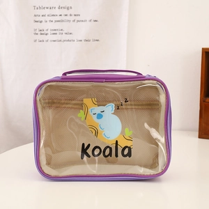 Detail of purple cartoon koala makeup bag with transparent PVC window and inner mesh pocket