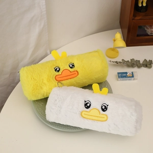 Detailed view of plush pencil cases with cute duck embroidery in yellow and white