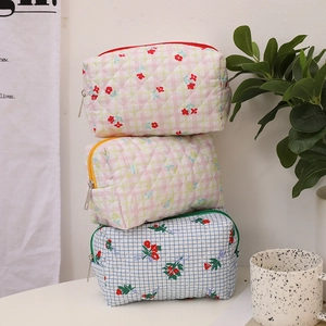 Quilted cotton makeup bags with floral cherry patterns and colorful zippers in three styles