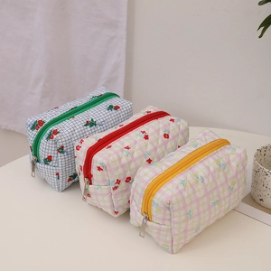 Quilted floral makeup bag set with cream bear pattern and zipper closure in three colors