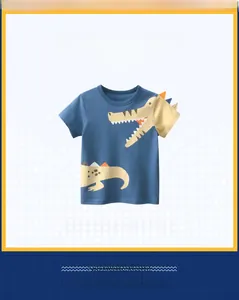 Detail of blue cotton boy T-shirt featuring cartoon crocodile print and 3D back fins