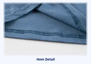 Detailed view of the hem stitching on a blue toddler short sleeve knit t-shirt