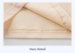 Close-up of beige knit shirt hem showing precise double-needle stitching and fabric texture
