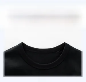 Detail of the crew neck collar and double-needle stitching on children's black tee