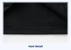 Detail of the black knit shirt hem showing precise double-needle stitching quality