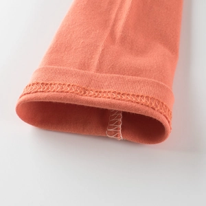 T-shirt manches longues enfant orange corail avec texture de poignet en maille premium
