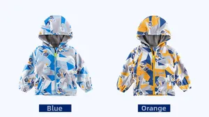 Detail of kids hooded windbreaker jackets with blue and orange space pattern prints