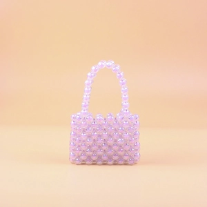 Handmade iridescent purple beaded mini handbag with top handle for a stylish look