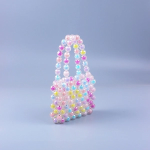 Detailed close-up of rainbow mini acrylic beaded handbag with colorful candy-tone beads