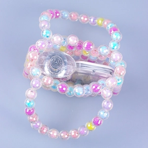 Handmade colorful acrylic beaded mini handbag with rainbow beads on blue background