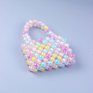 Macro detail of handmade mini acrylic beaded handbag with colorful iridescent finish