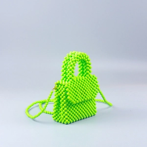 Detail of neon green handmade acrylic beaded handbag with detachable crossbody strap
