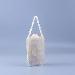 Handmade woven pearl shell bag with iridescent fish scale sequins and drawstring liner