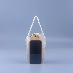 Handmade pearl and shell tile handbag with bead handle and elegant gold ribbon bow