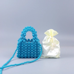 Blue handmade beaded handbag with matching long chain and white satin drawstring pouch