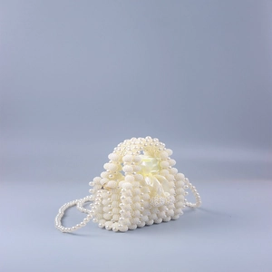 Handmade pearl beaded mini clutch bag with drawstring satin lining and crossbody strap