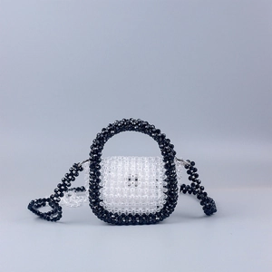 Handmade beaded mini handbag with black and clear acrylic beads and long shoulder strap