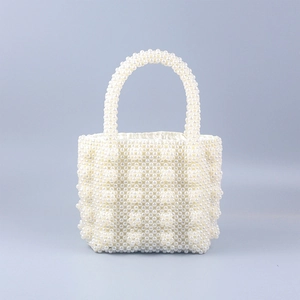 Elegant white beaded pearl handbag with woven texture and matching pearl handle