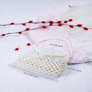 Detail view of handmade pearl beaded handbag showing specific size and dimensions