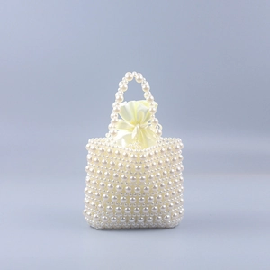 Handmade pearl beaded tote bag with a yellow satin drawstring liner for women