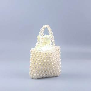 Elegant ivory faux pearl beaded handbag with satin drawstring lining for evening weddings