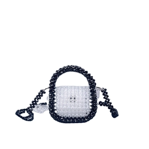 Handmade beaded mini bag with black and white acrylic beads and crossbody strap