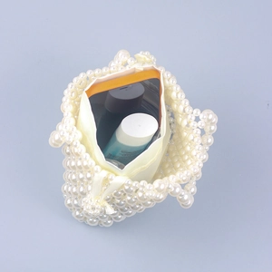 Handmade woven pearl handbag with satin drawstring lining and spacious interior