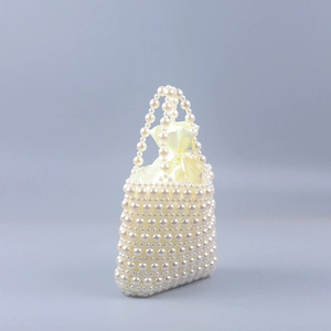 Elegant handmade faux pearl beaded handbag with satin drawstring lining in a trapezoid shape