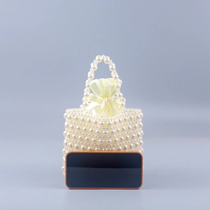 Handmade woven pearl handbag with silk drawstring bag and top handle for women