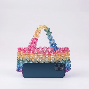 Colorful handmade beaded rainbow handbag for women with crystal beads and smartphone for scale