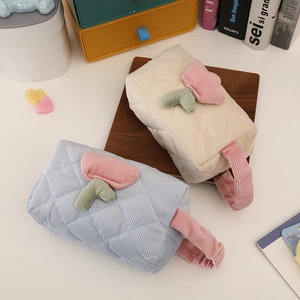 Quilted corduroy tulip makeup bags in light blue and beige with pink handles