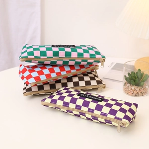Macro view of checkerboard canvas pencil cases in various vibrant color schemes