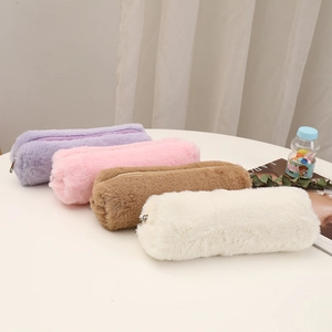Detailed group view of colorful plush pencil cases in soft pastel hues and textures