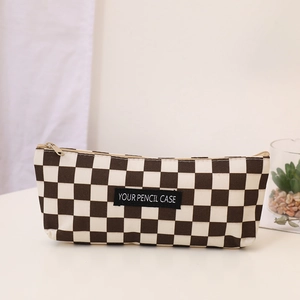 Detail of checkered pencil case with canvas texture and durable zipper closure