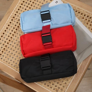 Minimalist waterproof nylon pencil case collection in blue, red, and black with buckle