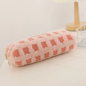 Detailed macro view of pink waffle fleece fabric texture and zipper on pencil case