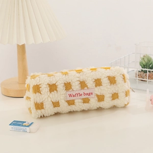 Detail of yellow waffle fleece pencil case with soft lamb wool texture and zipper closure