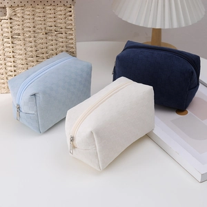 Checkered pencil cases in light blue, cream, and navy blue with high-capacity storage