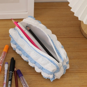 Detailed view of the large-capacity blue and white checkered seersucker pencil case
