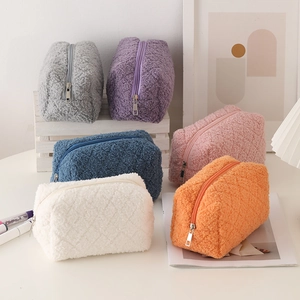 Plush teddy fleece pencil cases in six vibrant colors with soft quilted texture