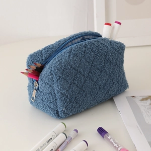 Blue lamb wool pencil case interior with diamond stitching and blue checkered lining
