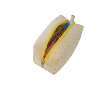 Checkered high-capacity fabric pencil case in pale yellow with zipper and art markers