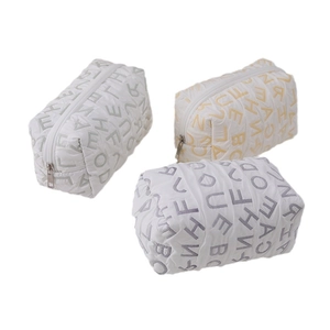 Set of three quilted canvas storage bags with letter prints and zipper closure