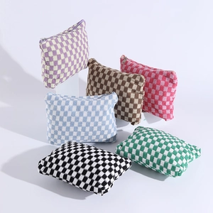 Detailed set of six checkered knit cosmetic bags in various vibrant color combinations