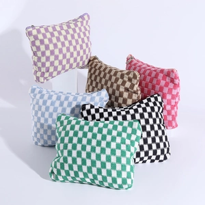 Knitted checkerboard makeup bag set in multiple colors with secure zip closure