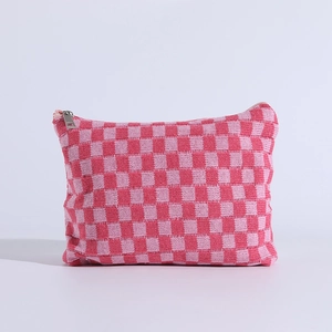 Pink checkered knit makeup bag with silver metal zipper and portable flat design