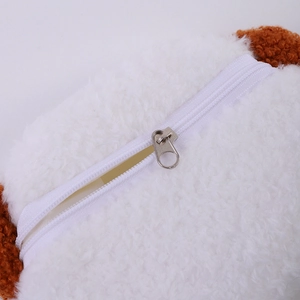 Detail of soft plush bear coin purse showing sheep-like texture and silver metal zipper