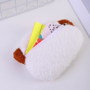 Detail view of a plush puppy coin purse with soft fur, brown ears and a white zipper closure