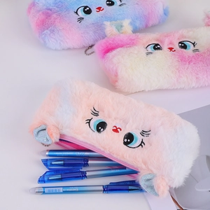 Detail of plush cat pencil cases showing soft fur texture and embroidered feline faces