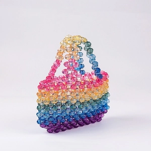 Handmade rainbow beaded mini handbag with acrylic faceted beads in a colorful gradient